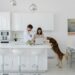 couple with dog in kitchen